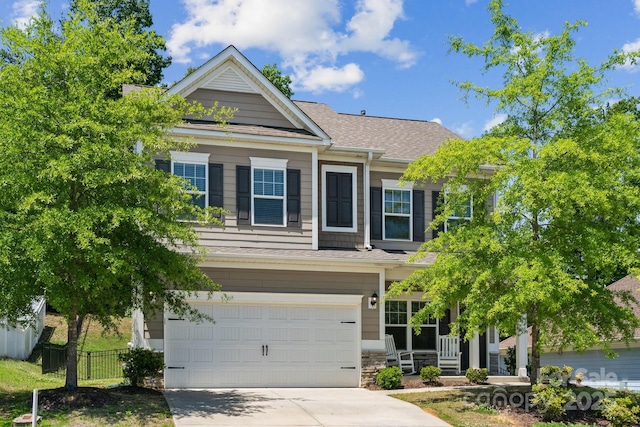 117 Cramerton Mills Parkway, Cramerton, NC 28032 - craftsman inspired home featuring a garage, fence, stone siding, roof with shingles, and driveway