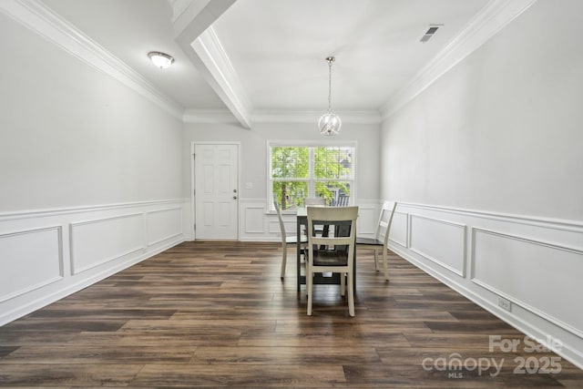 117 Cramerton Mills Parkway, Cramerton, NC 28032 - dining area with crown molding, dark wood-type flooring, a decorative wall, wainscoting, and a chandelier