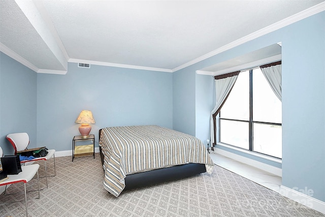 bedroom with light carpet, a textured ceiling, baseboards, visible vents, and ornamental molding