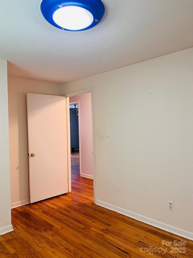 3232 Wilson Heights Dr, Hildebran, NC 28637 - spare room with wood finished floors and baseboards
