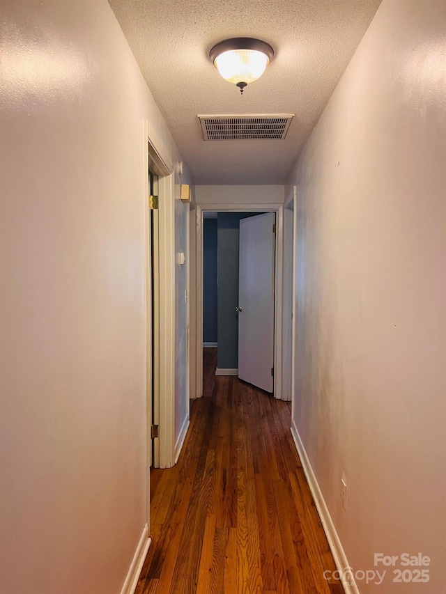 3232 Wilson Heights Dr, Hildebran, NC 28637 - hallway featuring wood finished floors and a textured ceiling