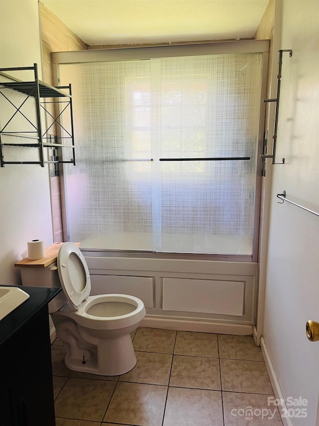 3232 Wilson Heights Dr, Hildebran, NC 28637 - full bathroom with tile patterned flooring, combined bath / shower with glass door, and vanity
