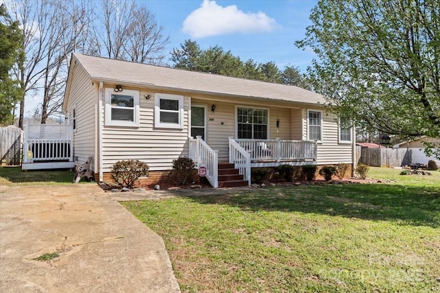 view of front of home featuring crawl space, a front yard, and fence