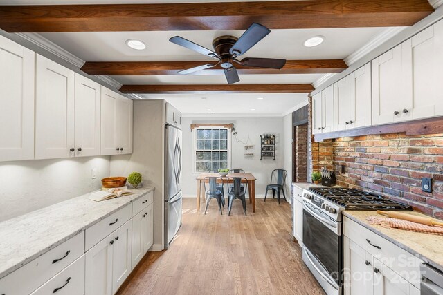 203 Davis Mountain Rd, Laurel Park, NC 28739 - kitchen with appliances with stainless steel finishes, beam ceiling, light wood finished floors, white cabinets, and ceiling fan