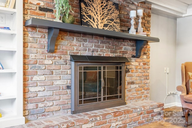 203 Davis Mountain Rd, Laurel Park, NC 28739 - detailed view of a brick fireplace and wood finished floors