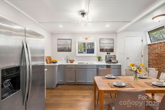 203 Davis Mountain Rd, Laurel Park, NC 28739 - kitchen featuring stainless steel fridge, gray cabinets, light wood-style flooring, light countertops, and a wooden ceiling with exposed beams
