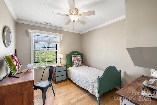 203 Davis Mountain Rd, Laurel Park, NC 28739 - bedroom featuring hardwood / wood-style flooring, crown molding, and ceiling fan