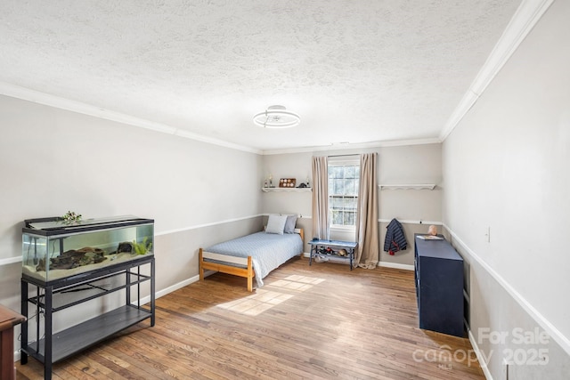 203 Davis Mountain Rd, Laurel Park, NC 28739 - bedroom with wood finished floors, crown molding, and a textured ceiling