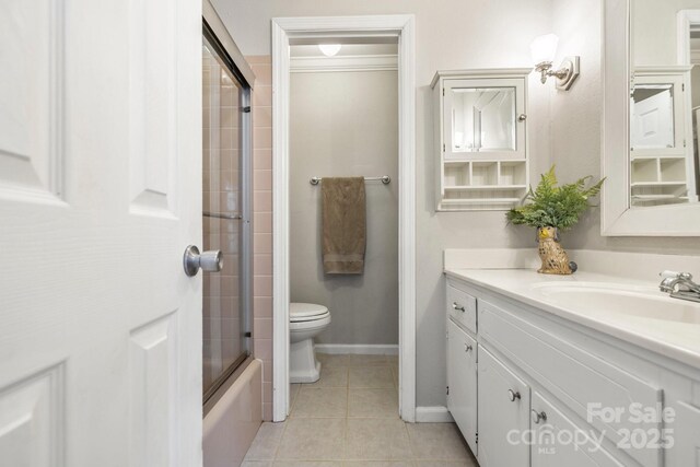 203 Davis Mountain Rd, Laurel Park, NC 28739 - bathroom featuring vanity, tile patterned floors, and shower / bath combination with glass door