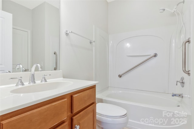 bathroom featuring toilet, vanity, and shower / bathing tub combination