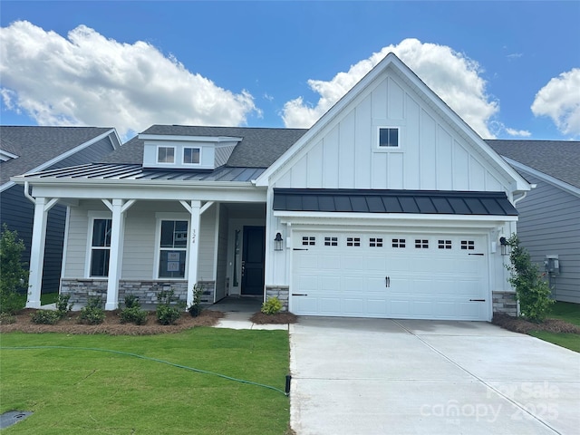 324 Basil Dr, Indian Trail, NC 28079 - view of front facade featuring a standing seam roof, a shingled roof, concrete driveway, and a front lawn