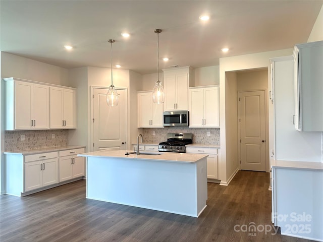 324 Basil Dr, Indian Trail, NC 28079 - kitchen with appliances with stainless steel finishes, tasteful backsplash, dark wood-type flooring, white cabinets, and recessed lighting
