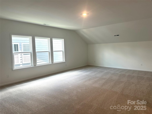 324 Basil Dr, Indian Trail, NC 28079 - additional living space with lofted ceiling and carpet