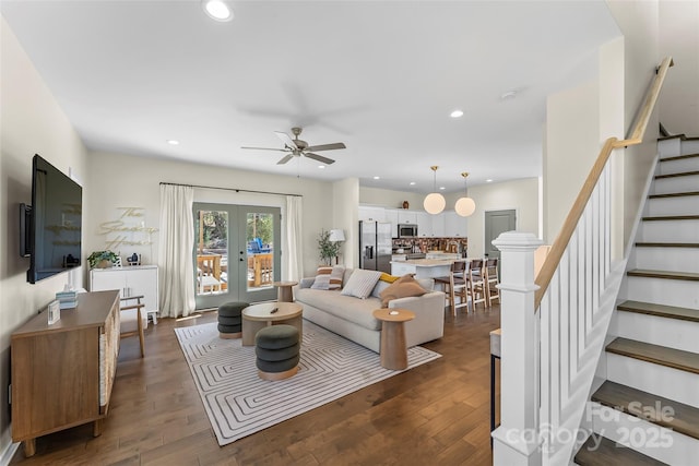living area featuring dark wood finished floors, stairway, recessed lighting, and french doors