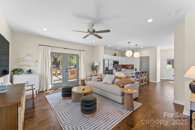 living room with dark wood finished floors, recessed lighting, french doors, and ceiling fan