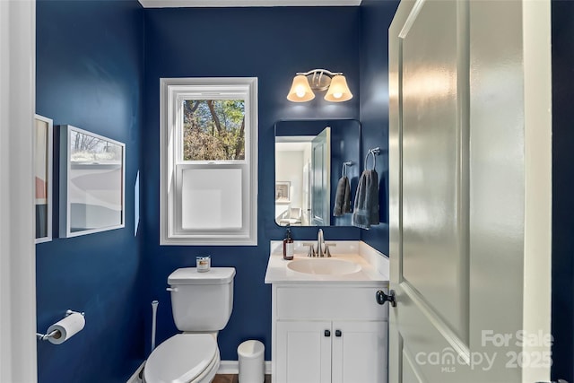bathroom with vanity and toilet