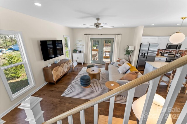 living area featuring dark wood-style floors, recessed lighting, french doors, and a ceiling fan