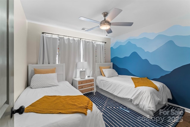 bedroom featuring visible vents, baseboards, and ceiling fan
