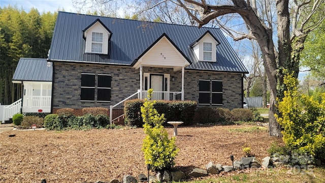 view of front of home featuring a porch and metal roof
