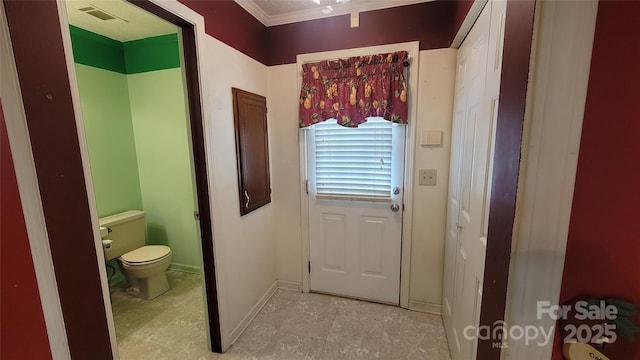 bathroom featuring toilet, baseboards, and visible vents