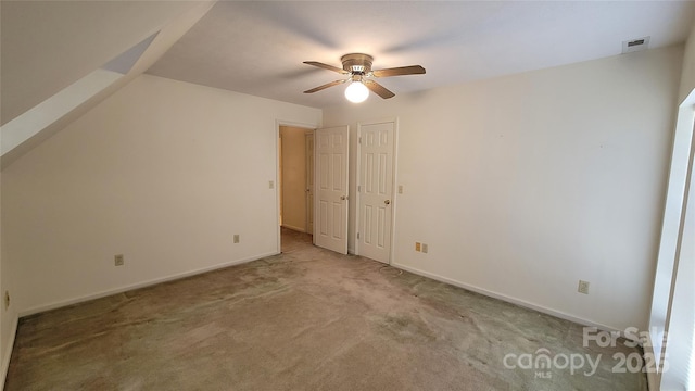 interior space with visible vents, carpet floors, baseboards, and ceiling fan