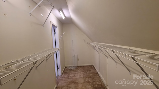 spacious closet featuring lofted ceiling