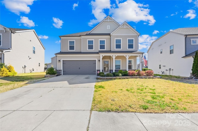 craftsman-style home featuring board and batten siding, concrete driveway, a front yard, covered porch, and a garage