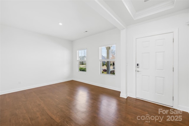 entryway with dark wood-style floors, baseboards, and ornamental molding