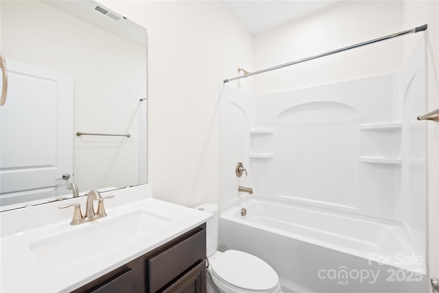 full bathroom with vanity, toilet, tub / shower combination, and visible vents
