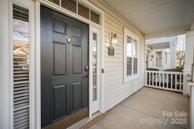 entrance to property with covered porch