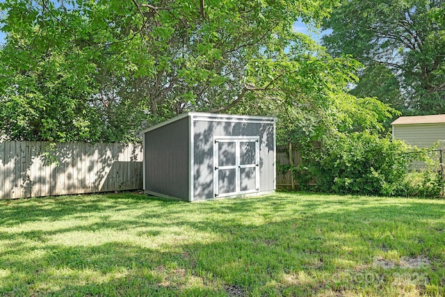 view of shed featuring a fenced backyard
