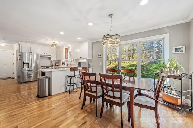 7025 Ridgeway Rd, Stanley, NC 28164 - dining space with recessed lighting, crown molding, and light wood-type flooring