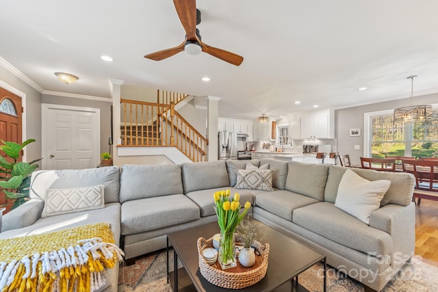7025 Ridgeway Rd, Stanley, NC 28164 - living area with a ceiling fan, stairs, light wood-type flooring, crown molding, and recessed lighting