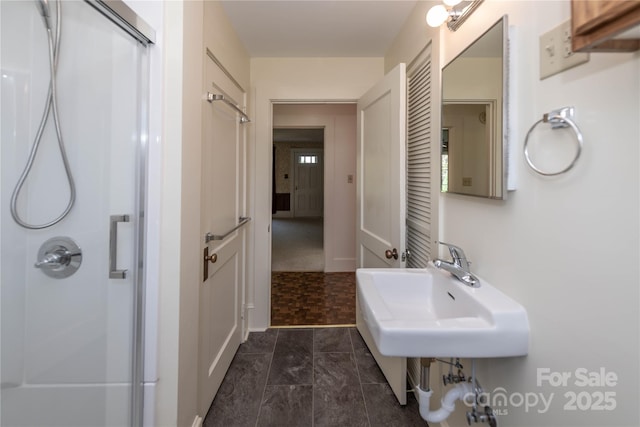 full bathroom featuring a shower with shower door