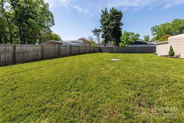 view of yard with a fenced backyard