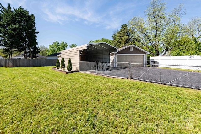 exterior space featuring a yard, a detached carport, and fence