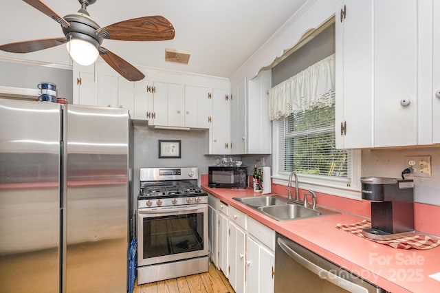 1041 Cutler Pl, Charlotte, NC 28212 - kitchen featuring light countertops, white cabinets, a sink, and stainless steel appliances