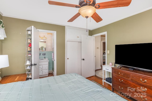 1041 Cutler Pl, Charlotte, NC 28212 - bedroom with crown molding, wood finished floors, and a ceiling fan