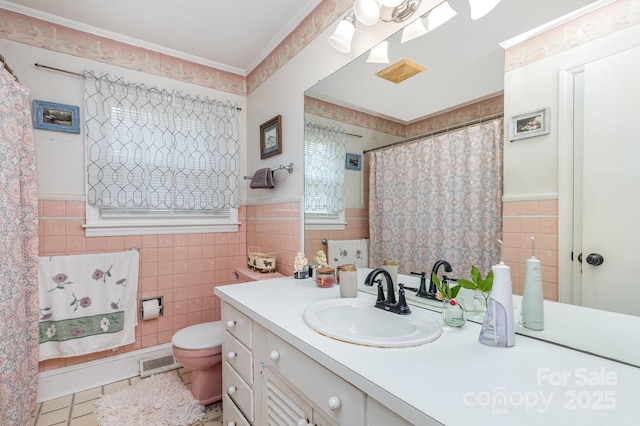 1041 Cutler Pl, Charlotte, NC 28212 - bathroom featuring tile walls, visible vents, toilet, and vanity