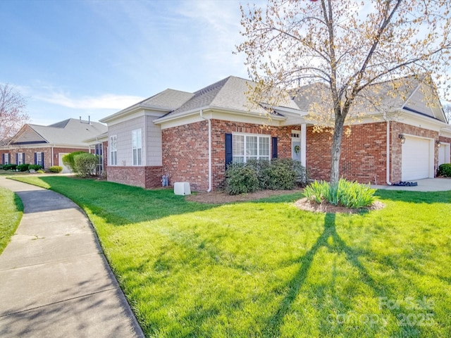 4118 Compostela Ct, Monroe, NC 28110 - view of front facade with brick siding, a garage, and a front lawn