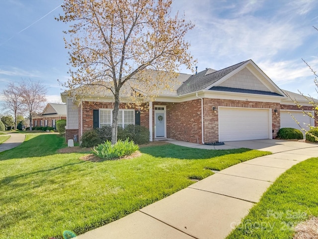 4118 Compostela Ct, Monroe, NC 28110 - view of front of house with brick siding, a garage, concrete driveway, and a front yard