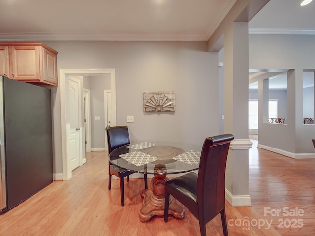4118 Compostela Ct, Monroe, NC 28110 - dining area with baseboards, ornamental molding, and light wood finished floors