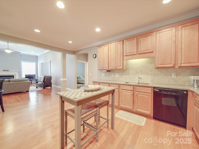 4118 Compostela Ct, Monroe, NC 28110 - kitchen featuring light countertops, light wood-type flooring, light brown cabinetry, a sink, and dishwasher