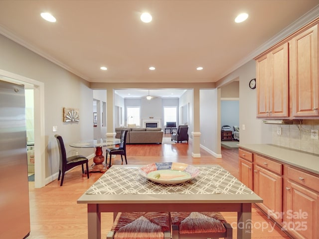 4118 Compostela Ct, Monroe, NC 28110 - kitchen with light brown cabinets, light wood finished floors, crown molding, and freestanding refrigerator