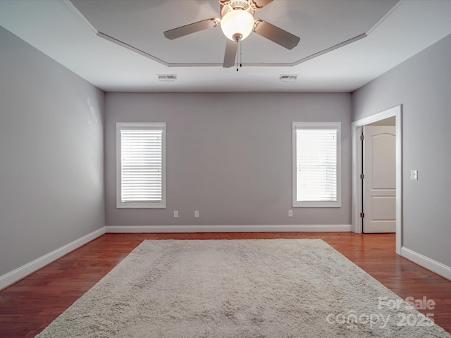 4118 Compostela Ct, Monroe, NC 28110 - empty room with attic access, visible vents, wood finished floors, and a ceiling fan
