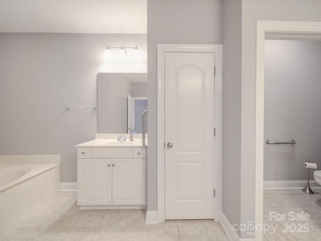 4118 Compostela Ct, Monroe, NC 28110 - full bathroom featuring tile patterned floors, toilet, vanity, a garden tub, and baseboards