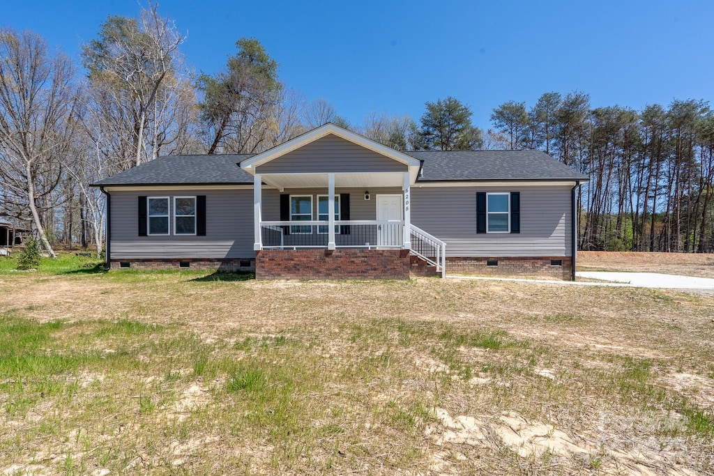 6205 Faith Rd, Salisbury, NC 28146 - view of front of property with a shingled roof, crawl space, and a porch
