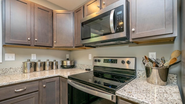 28 Arnie Dr, Etowah, NC 28729 - kitchen with light stone counters, dark brown cabinets, and stainless steel appliances
