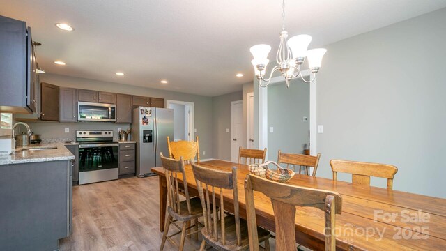 28 Arnie Dr, Etowah, NC 28729 - dining room with an inviting chandelier, recessed lighting, and light wood finished floors