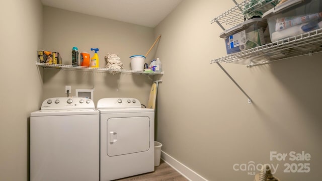 28 Arnie Dr, Etowah, NC 28729 - washroom with laundry area, wood finished floors, separate washer and dryer, and baseboards